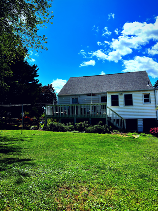 House with green grass and blue sky